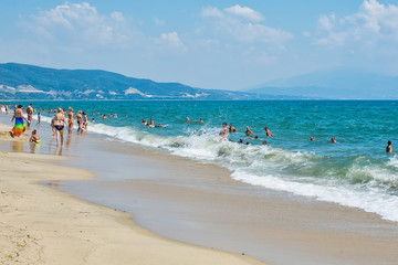 Fototapeta premium Asprovalta, Greece - August 20, 2018: Asprovalta and New Vrasna resort, Asprovalta beach. Sea view to Asprovalta at the foot of the green hills.