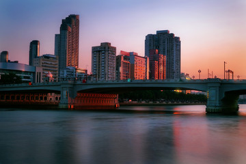 Guangzhou city skyline at sunset. Zhujiang (Pearl) River, view from Xidi Wharf.