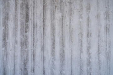 Obraz premium wood grain imprints in a concrete wall for backgrounds
