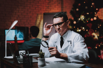 Doctor Examining Cactus in Office on New Year Eve.