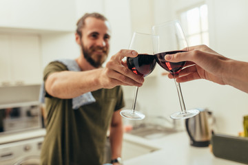 Man toasting wine with a friend