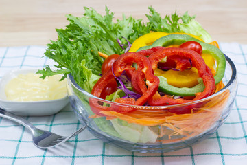 Close up A green salad is a dish consisting of a mixture of small usually vegetables 