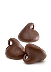 Chocolate chips morsels from top view isolated on white background