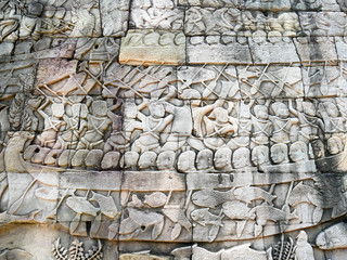 Bas-relief Sculpture of sea battle at Bayon temple in Angkor Thom, Siemreap, Cambodia. Angkor Thom is a popular tourist attraction.