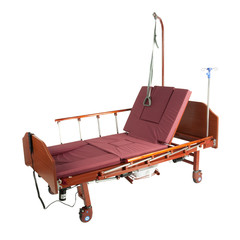 Medical brown metal bed on wheels with burgundy mattress