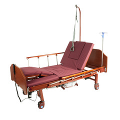 Medical brown metal bed on wheels with burgundy mattress