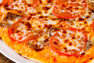 Pizza with beef and tomato