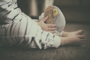 Boy holding a teddy