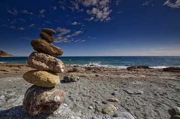 Pebble statue on Spanish beach
