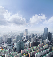 Fototapeta na wymiar Seoul cityscapes, skyline, high rise office buildings and skyscrapers in Seoul city, winter daylight, top view in winter, Seoul, Republic of Korea, in mist winter season with blue sky and cloud