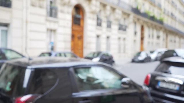 Out of focus background plate of street parking in European city