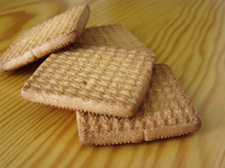 Close up of cookies on wooden table . Four biscuits for breakfast
