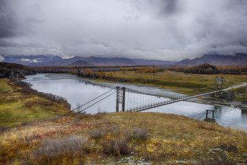 Fototapeta premium The bridge over the mountain river