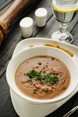 Goulash soup with beans, bell peppers and garlic croutons.