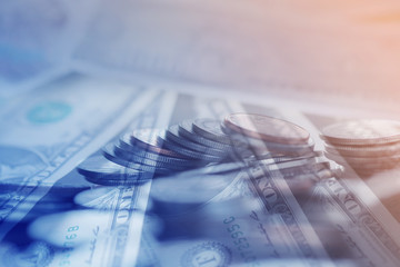 Double exposure Rows of coins of Clock,cash,money, dallar on the table,finance and business concept,Tex time soft focus and blurred style,dark tone.