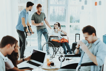 Smiling Disabled Woman and Men with Glasses Juice