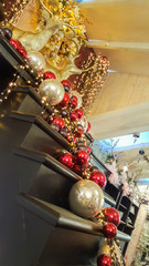wooden staircase decorated with red and golden Christmas balls