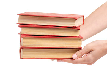 Stack of books in hand on a white background isolation
