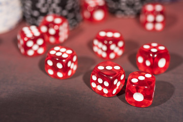 Casino abstract photo. Poker game on red background. Theme of gambling