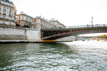 Naklejka premium View on the riverside from the boat sailing on Seine river during the sunset in Paris