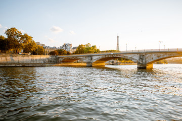 Obraz premium Landscape view on the riverside from the boat sailing on Seine river during the sunset in Paris