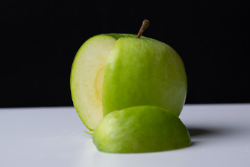 Green apple with slice taken out