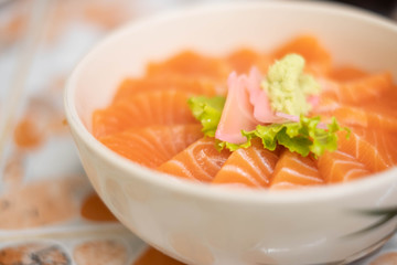 Salmon don - Bowl of steamed rice with salmon sashmi, Japanese traditional food.