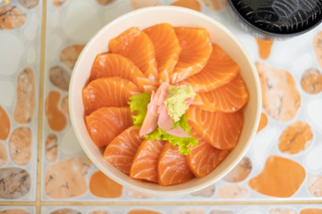 Salmon don - Bowl of steamed rice with salmon sashmi, Japanese traditional food.