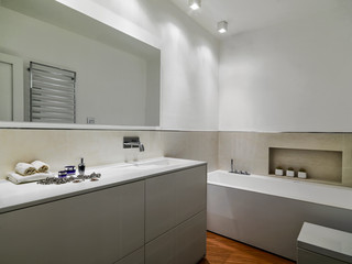 Fototapeta na wymiar modern bathroom interiors in the foreground the sink cabinet with built-in washbasin