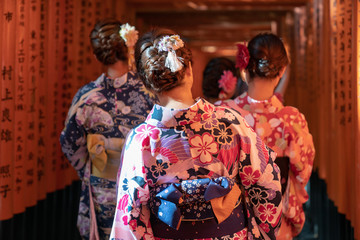 Girls walkin Fushimi Inari Shrine on Geisha attire