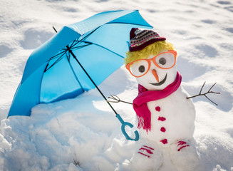 Snowman on snow background