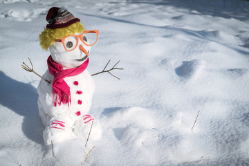 Snowman on snow background