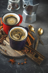 Winter coffee with spices in color enamelled cups