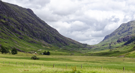 Driving through Glencoe in the Lochaber area of the Highlands of Scotland, United Kingdom, site of the 1692 infamous massacre of the MacDonald clan by the Campbells © teesixb