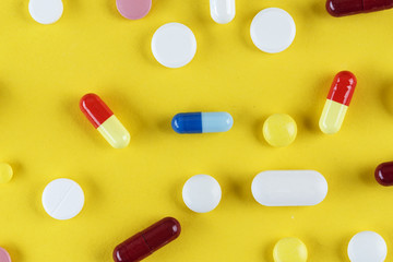 different pills are scattered