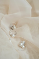 wedding ring pearl background pastel pink fabric background