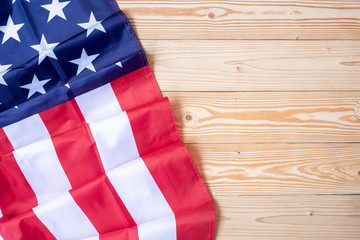 flag of the United States of America on wooden background. USA holiday of Veterans, Memorial, Independence and Labor Day. copy space  for text