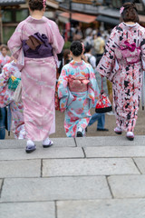 Girls in geisha costume taking a selfie