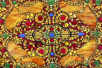 Stained glass window with colorful oriental ornament.