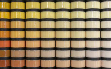 Jars with paint for repair various shades.