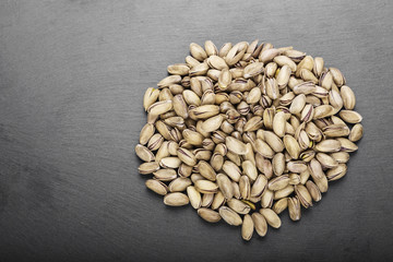 pistachios on black background