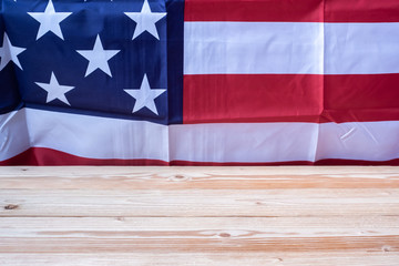 Fototapeta na wymiar flag of the United States of America with wooden table. USA holiday of Veterans, Memorial, Independence and Labor Day. copy space for text