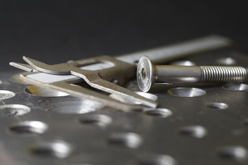 steel plate with a screw and a caliper