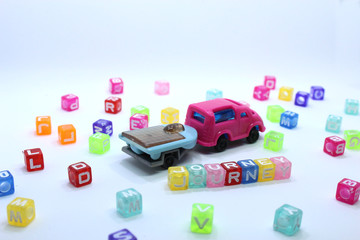 Obraz premium toy car on white background with journey word