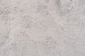 Fototapeta premium Wall fragment with scratches and cracks. It can be used as a background