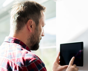 Man using smart home device