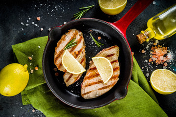 Grilled tuna fish steaks with lemon and spices