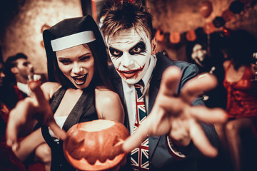 Portrait of Young Couple in Halloween Costumes