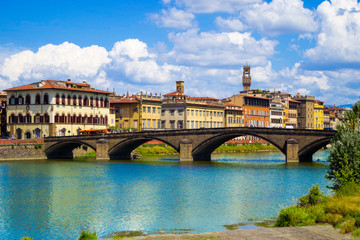 Naklejka premium Florence or Firenze, a view of the Arno River and the Ponte Santa Trinita Bridge