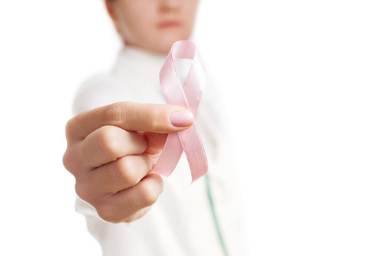 Medic holding pink ribbon isolated on white. Pink ribbon. Symbol of breast cancer awareness.  National Breast Cancer Awareness Month. Mammography Day.